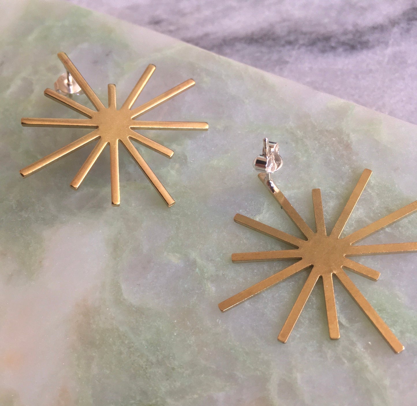Brass starburst earrings