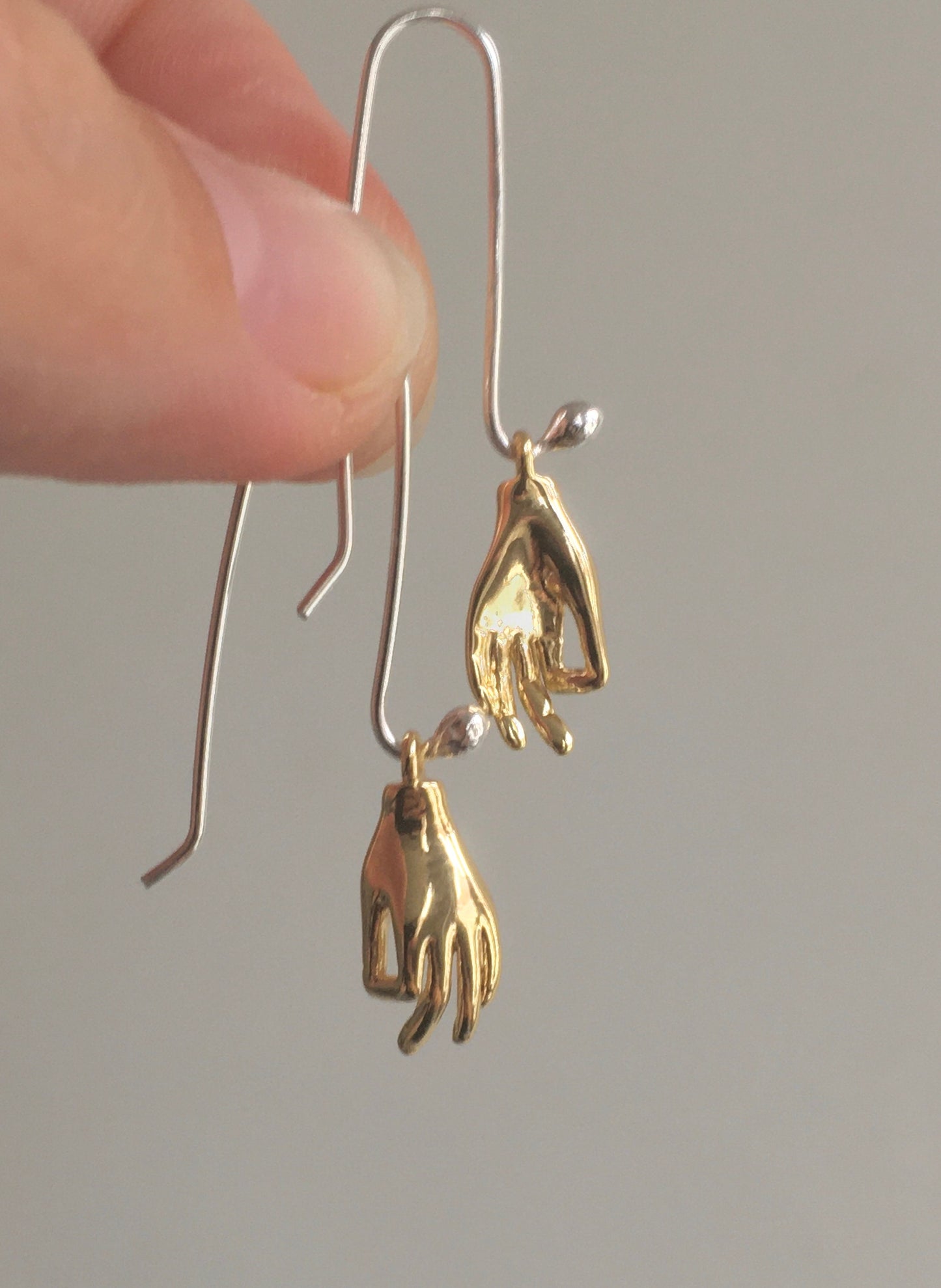 Helping hand earrings
