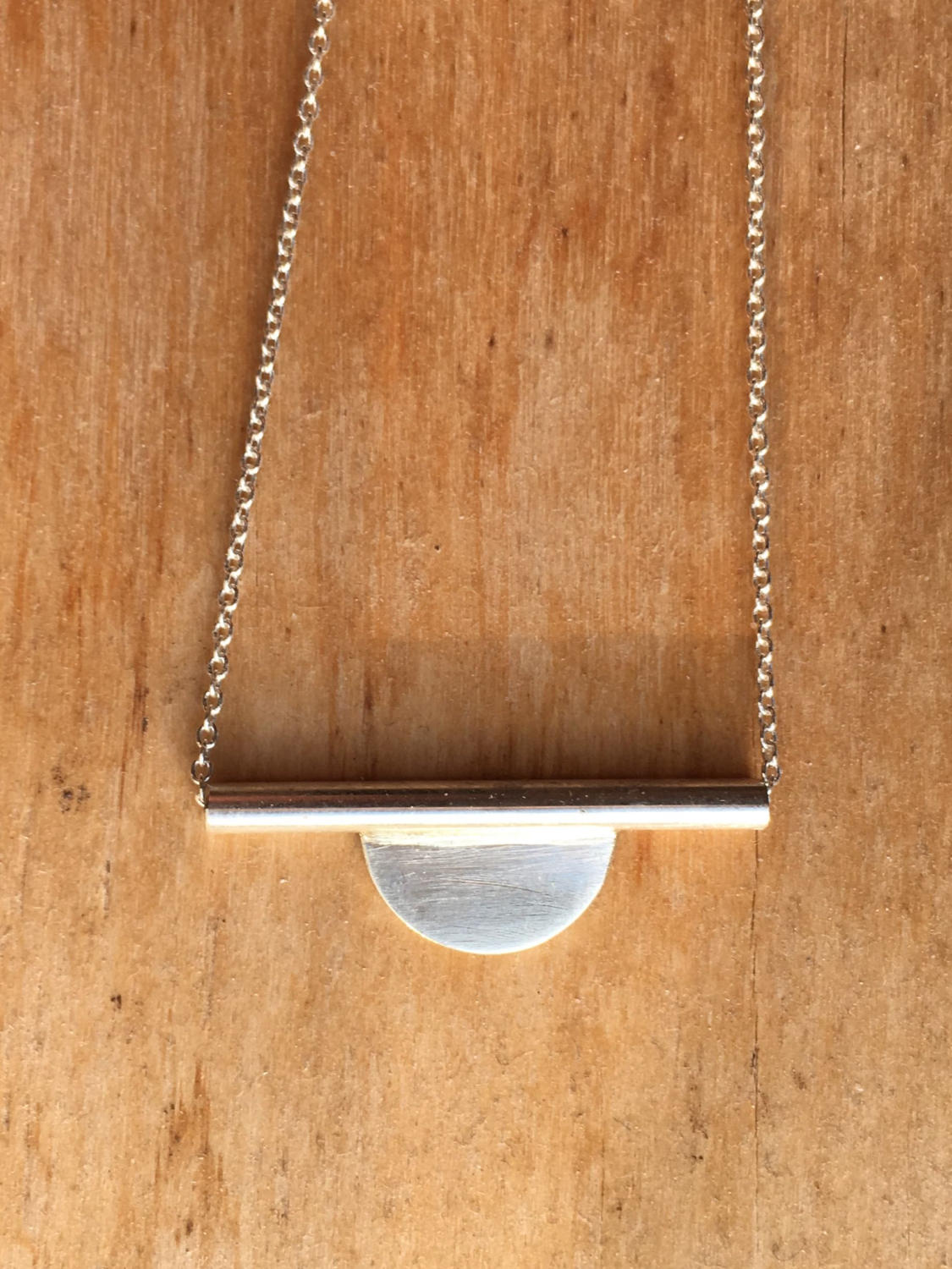 Modern setting sun necklace
